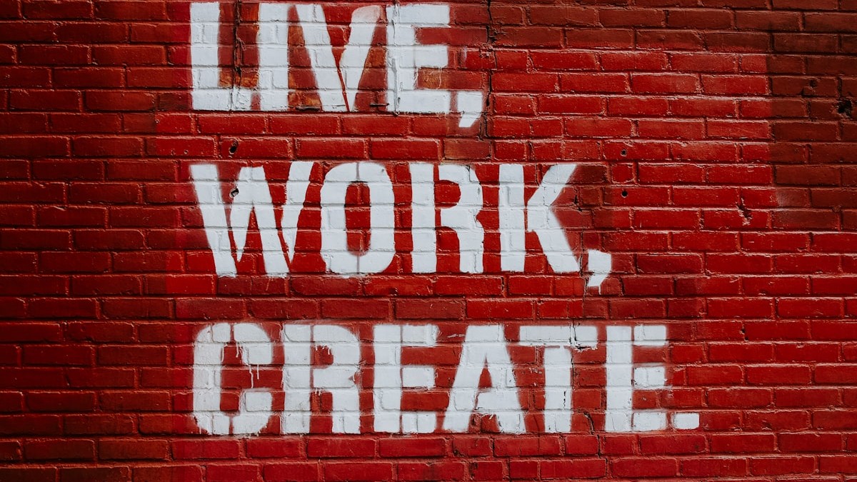 Live, Work, Create. graffiti on brick wall