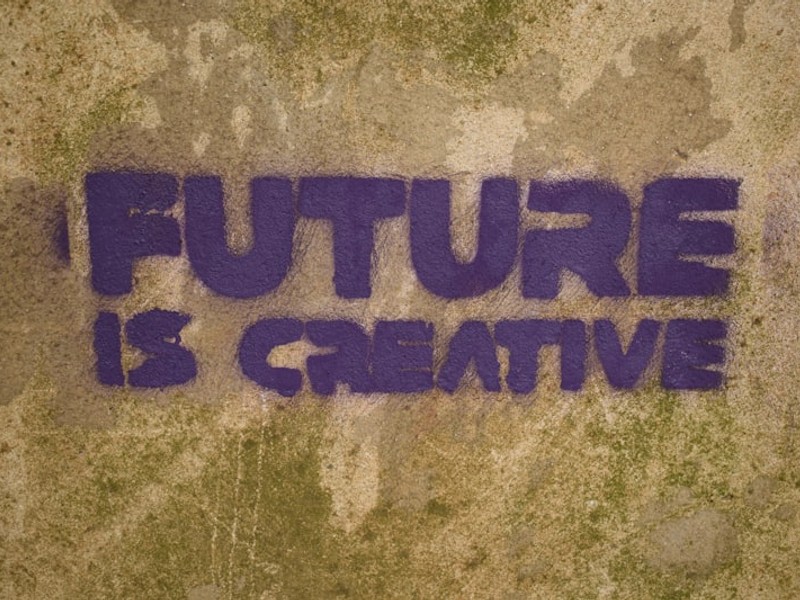 the words future is creative painted on a wall